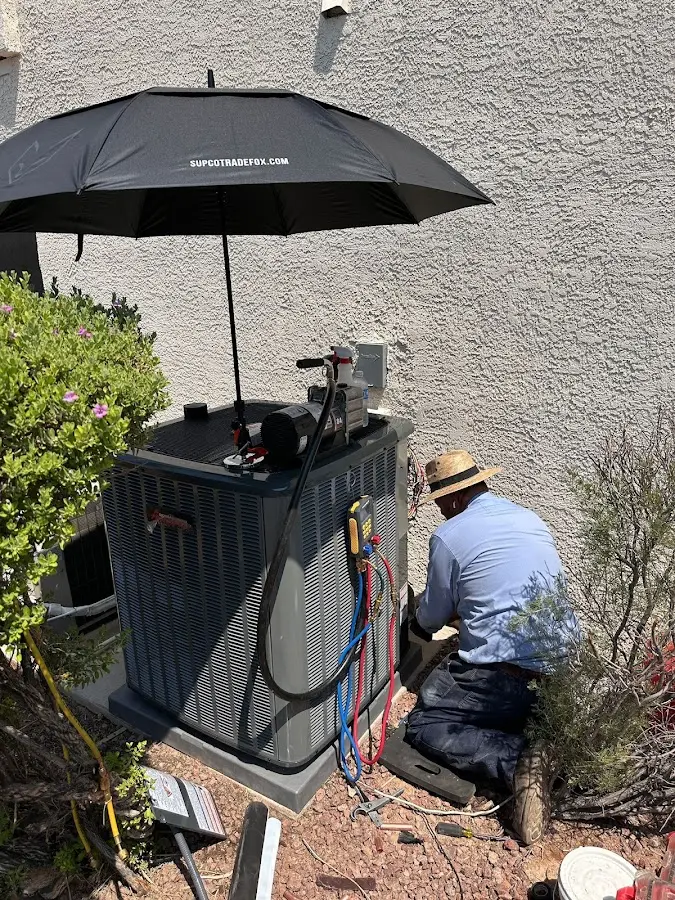 HVAC technician performing outdoor AC maintenance in Merritt Island
